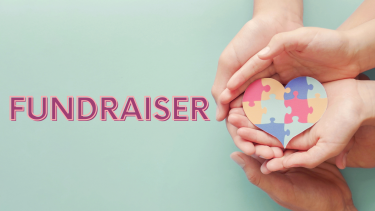 Fundraiser words with 2 hands holding a puzzle heart