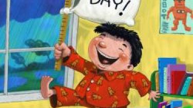 cartoon picture of boy in Pjs holding a pajama day sign